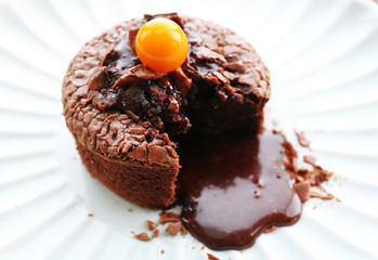 Hot chocolate pudding with fondant centre on plate, close-up