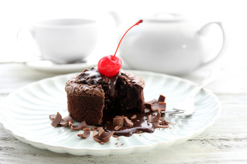 Hot chocolate pudding with fondant centre on plate, close-up
