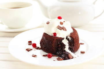 Fototapeta na wymiar Hot chocolate pudding with fondant centre with ice-cream,