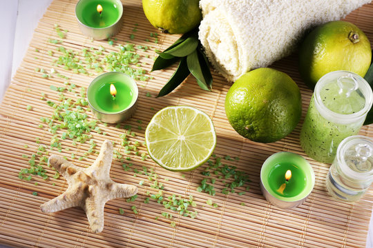 Spa composition with lime, towel and candles