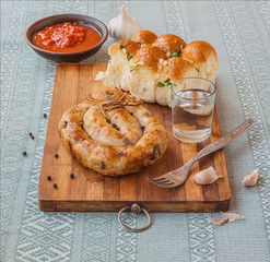 Ring homemade sausage and glasses of vodka