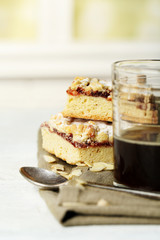 Glass of espresso and tasty homemade pie on wooden table
