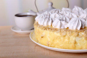 Tasty homemade meringue cake and cup of tea