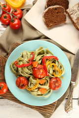 Tasty pasta with pepper, carrot and tomatoes