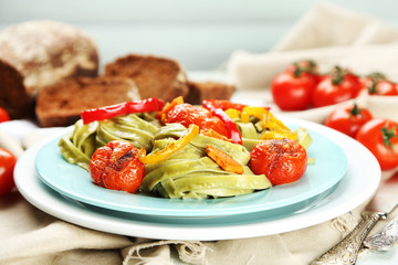 Tasty pasta with pepper, carrot and tomatoes