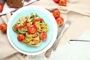 Tasty pasta with pepper, carrot and tomatoes