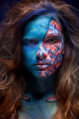 Beautiful face of a woman covered in glitter. Face art. Sexy