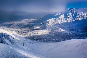 Sunrise over the winter mountain valley