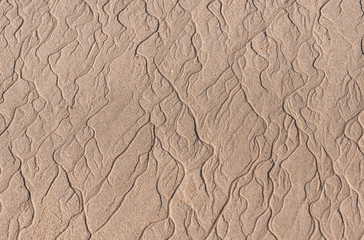closeup of sand pattern of a beach in the summer thailand