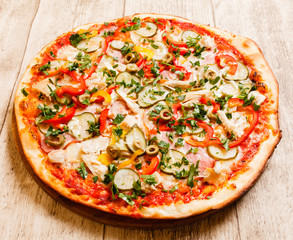 pizza on the wood background