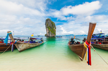 Fototapeta na wymiar Fishing thai boats and landmark at Po-da island, Krabi ,Thailand
