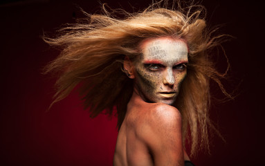 Creative Girl Portrait. Golden Makeup. Face art and body art. 