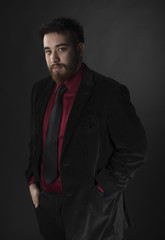 Young Man Wearing Maroon and Black Formal Attire