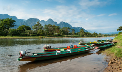 Obraz premium long tail boats on Song river, Vang Vieng,Laos.