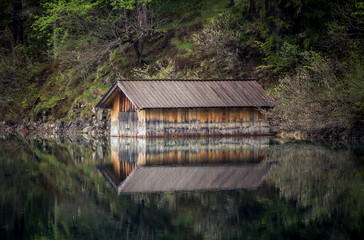 A small wooden house on the lake