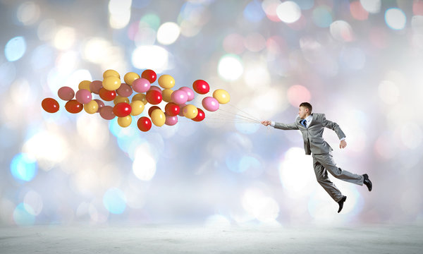 Businessman with balloons