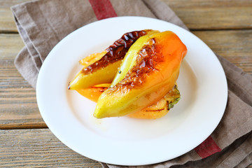 Tasty roasted peppers in a white plate
