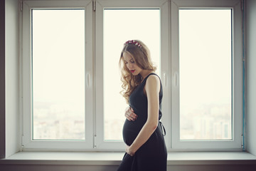 beautiful pregnant woman at home portrait