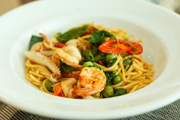 Spaghetti seafood on white plate