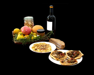 Mediterranean lunch with wine, fruits and home made pizzas.