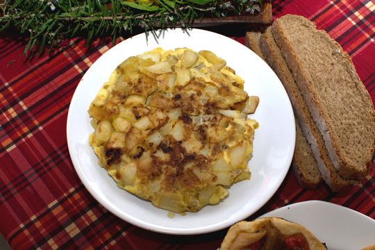 Tortilla de patata on white plate, Mallorca, Spain.