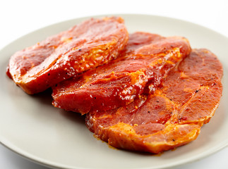Pork neck slices on a plate
