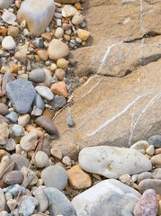 Rock and pebble stones in the shape of the letter 'L'.