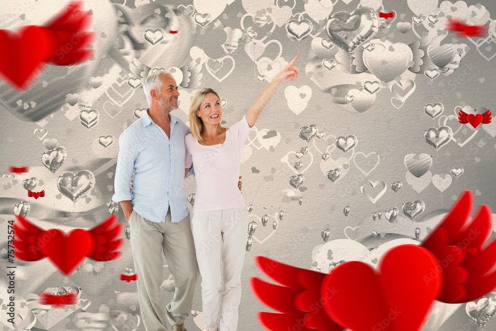 Aufkleber Composite image of smiling couple walking and pointing
