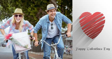 Composite image of hip young couple going for a bike ride