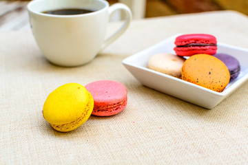 Colorful macaroons and a cup of coffee