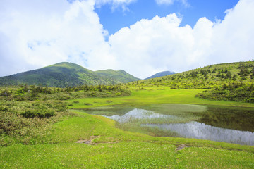 Fototapeta na wymiar Tamoyachi marsh and Mt. Hakkodasan, Aomori