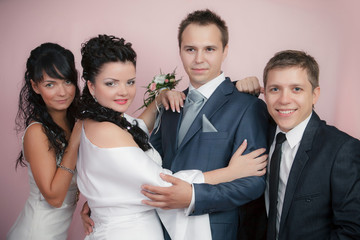 the groom, the bride and the best man with the witness