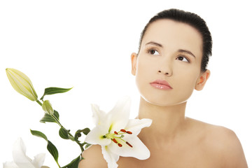 Fototapeta premium Woman with healthy skin and lily flower