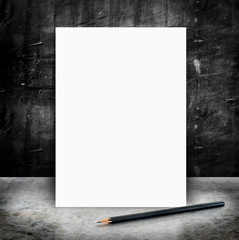 Blank White poster and pencil in a glossy concrete floor and bla