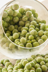 frozen pea on an old wooden table