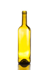 empty wine bottle yellow glass on a light background with reflec