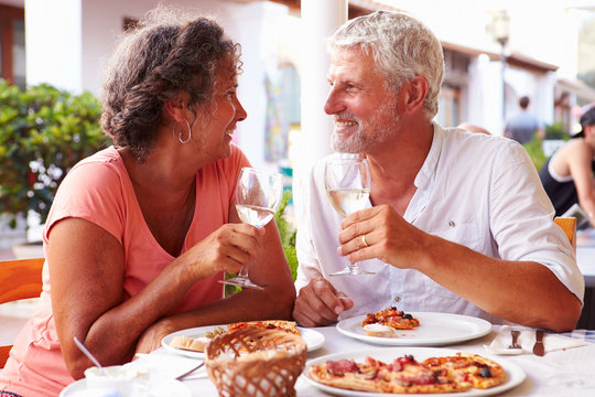 Mature Couple Eating Meal Outdoors Together