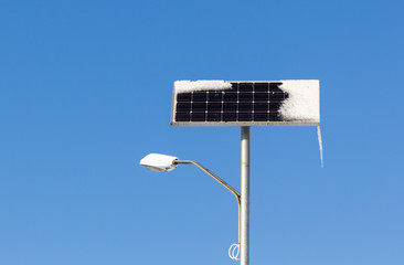 Solar power street light with snow and ice