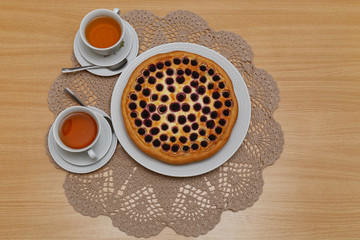 Pie and two cups of tea