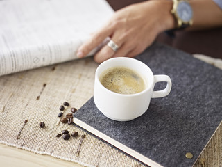 man drinking coffee and reading