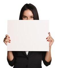 Business woman holding in hand a blank sheet of white cardboard