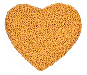 White mustard in the form of heart on a white