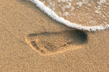 Fototapeta na wymiar footprints in the sand