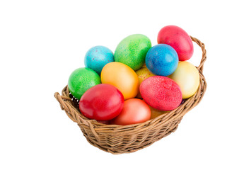 Fototapeta na wymiar Colorful easter eggs in basket. Isolated