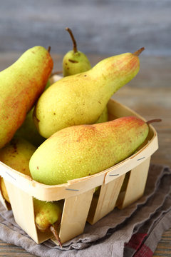 Sweet pears in a wooden box