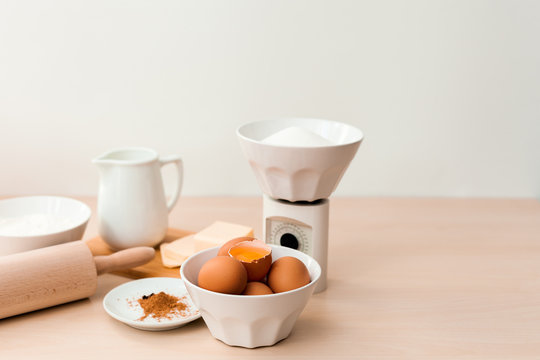 kitchen weight balance and bake ingredients on wooden table - Powered by Adobe