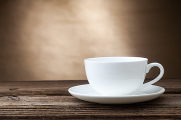 Empty coffee cup on old wood