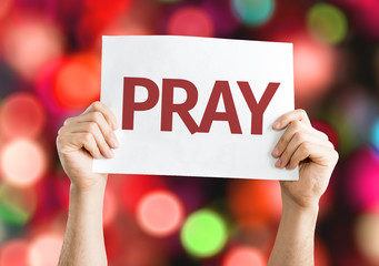 Pray card with colorful background with defocused lights - obrazy, fototapety, plakaty
