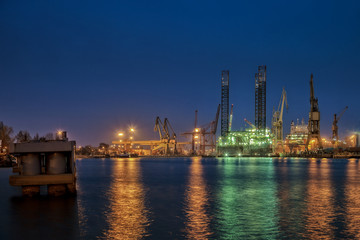 Fototapeta na wymiar Oil drilling platform for repairs at shipyard in Gdansk, Poland