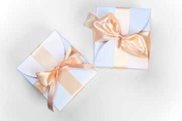 Two boxes with pink bows